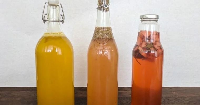 three bottles of flavored kombucha after second fermentation